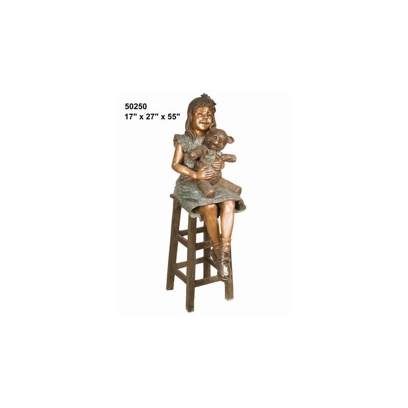 GIRL SITTING ON STOOL WITH TEDDY STATUE